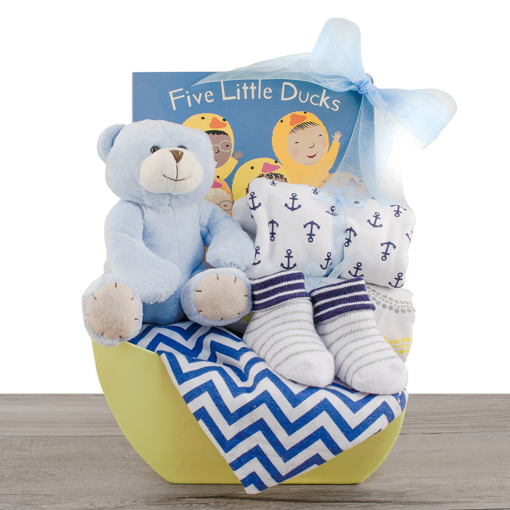 polar bear rattle, soccer cozy, baby sleep gown and blanket in polka dot gift basket